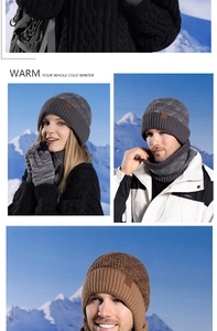 Close-up of cable knit beanie and scarf set featuring leather patch in outdoor snowy setting