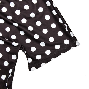 Macro shot of polka dot fabric detail showing smooth texture and high-quality stitching