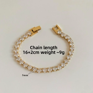 Detail view of gold-tone tennis bracelet with 5mm clear zircons and 16cm plus 2cm chain