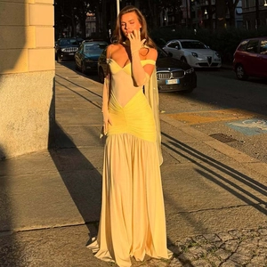 Elegant yellow off-shoulder evening dress with sheer mesh paneling and matching gloves