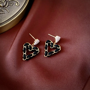 Vintage gold heart earrings with black woven leather chain and elegant white pearls