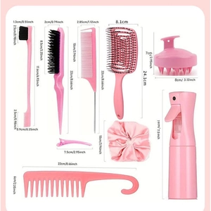 Pink hair styling tool set with combs, scalp brush, spray bottle and clips on flat lay