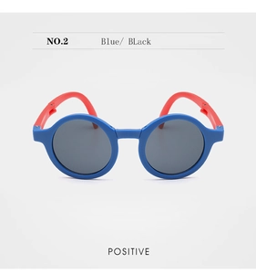 Front view of foldable blue and red kids sunglasses with round dark grey lenses