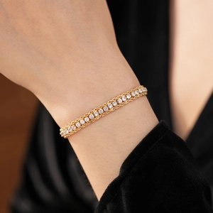 Detailed shot of golden adjustable chain bracelet with sparkling pavé-set cubic zirconia