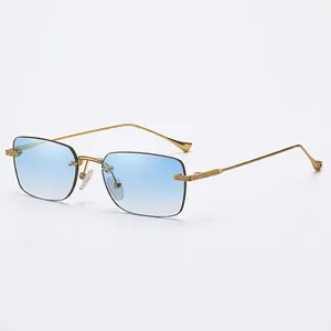 Frameless square sunglasses with light blue gradient lenses and gold metal temples