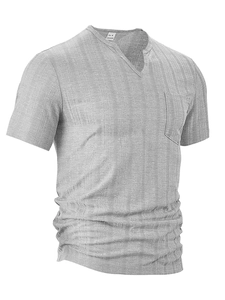 Close-up of gray short-sleeve shirt showing textured vertical fabric and chest pocket