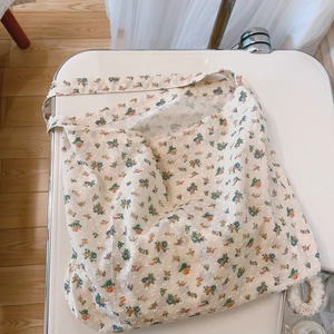 Floral cotton canvas tote bag with colorful print and textured dotted swiss fabric detail