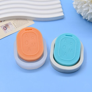 Oval silicone molds for DIY aromatherapy stones with AROMA lettering and floral decor