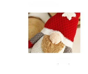 Detailed close-up of a handcrafted Nordic Christmas gnome with a red star-patterned hat