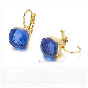 Detail view of square blue crystal glass earrings with a polished gold finish