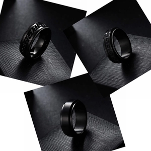Three-piece set of men's black plated stainless steel spinner rings in various textures