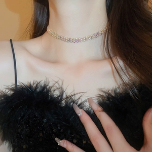 Close-up of luxury geometric rhinestone choker on model with sparkling multi-color diamonds