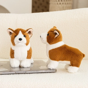 Close-up of soft plush corgi toy with fluffy orange and white fur on a home sofa