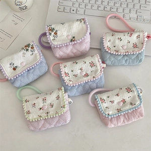 Floral quilted camera storage pouches in multiple colors with heart stitching and lace trim