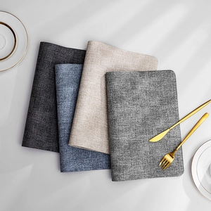 Set of four linen-textured waterproof placemats in grey, blue, and beige colors