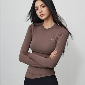 Brown ribbed long sleeve yoga top with crew neck and AMI MEDEA logo for fitness workout