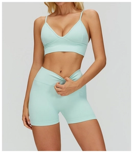 Detail of mint green seamless ribbed sports top and high waist shorts set