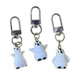 Three cute 3D resin penguin keychains with metal spring hooks and enamel finish charms