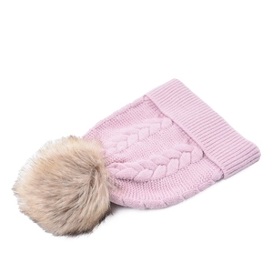 Detailed view of pink cable knit beanie with large fluffy detachable faux fur pom-pom