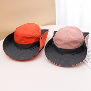 Detail view of pink and orange wide brim sun hats with breathable mesh and side snap buttons