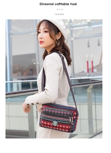 Ethnic style crossbody bag with bohemian stripes worn by a model in an urban setting