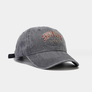 Detailed close-up of BROOKLYN 1898 embroidery on a washed grey vintage baseball cap