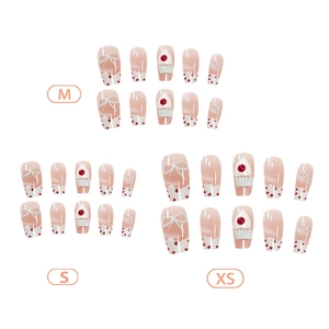 Handmade cat eye press-on nails in pink with 3D bows and cherry patterns in sizes XS, S, M