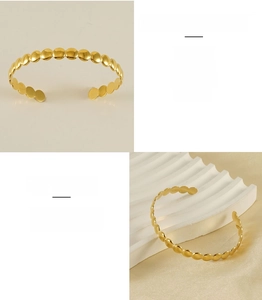 Detailed view of adjustable golden C-shaped stainless steel cuff with polished discs