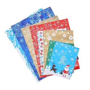 Assorted Christmas drawstring gift bags with snowflake and reindeer festive patterns