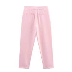 Detail of pink high-waisted suit trousers featuring back pocket design and neat stitching