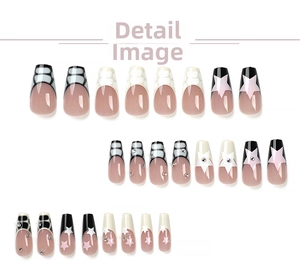 Detail of 24pcs coffin press-on nails with black white geometry and pink star patterns