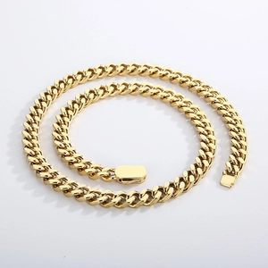 Close-up of a gold-plated titanium steel Cuban link chain with a square box clasp closure