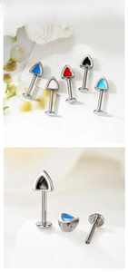 Detailed macro view of F136 titanium cat ear cartilage studs with internal thread and enamel