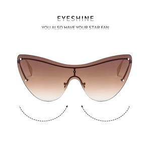 Front view of rimless cat-eye sunglasses with brown gradient lenses and metal bridge