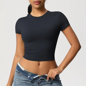 Close-up of tight-fitting black cropped sports T-shirt with high-elasticity fabric