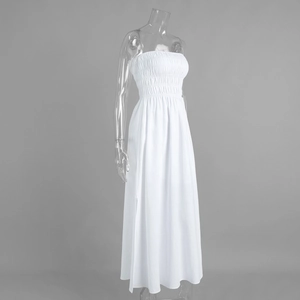 Detail view of white cotton tube maxi dress featuring smocked bodice and tiered pleated fabric