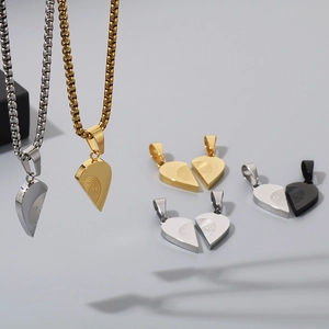 Macro detail of stainless steel puzzle heart pendants with unique fingerprint engraving