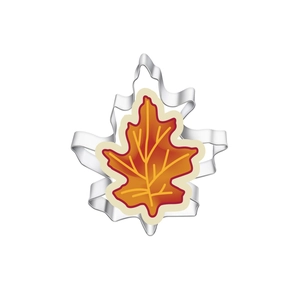 Close-up of maple leaf stainless steel cookie cutter with orange gradient dough detail