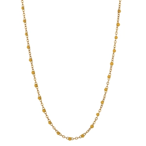Close-up of a gold stainless steel chain necklace with small yellow bead accents