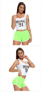 Close-up of neon green stretch yoga shorts and white tank top with Original 91 print