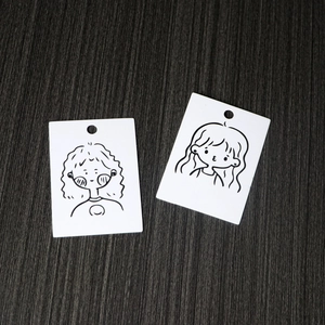 Minimalist earring display cards with cute cartoon girl illustrations on white cardstock