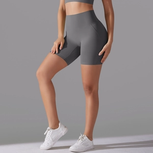 Close-up of high-waisted seamless yoga shorts in dark grey with curved side stitching