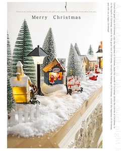 Illuminated Christmas village scene with glowing candy store, Santa and snow trees