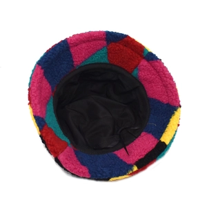 Colorful patchwork faux lamb wool bucket hat with warm winter lining and thick texture