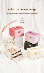 Multi-tier jewelry box in pink, black and beige faux leather with gold lock and handle