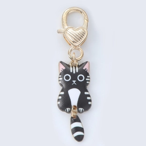 Detail of cute black cat enamel keychain with heart lobster clasp and moving tail charm