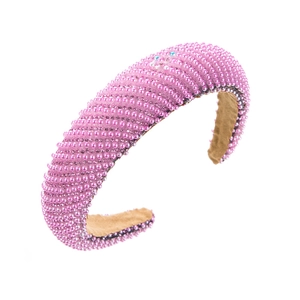 Padded pink headband with sparkling pearls and rhinestones for elegant hair styling