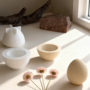 Macro detail of the woven texture on egg-shaped resin molds with lids and decorative props