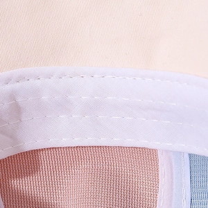 Detailed close-up of breathable mesh fabric and double-stitch seam on baby baseball cap