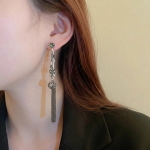 Vintage silver long tassel earrings with emerald green stones and diamond accents